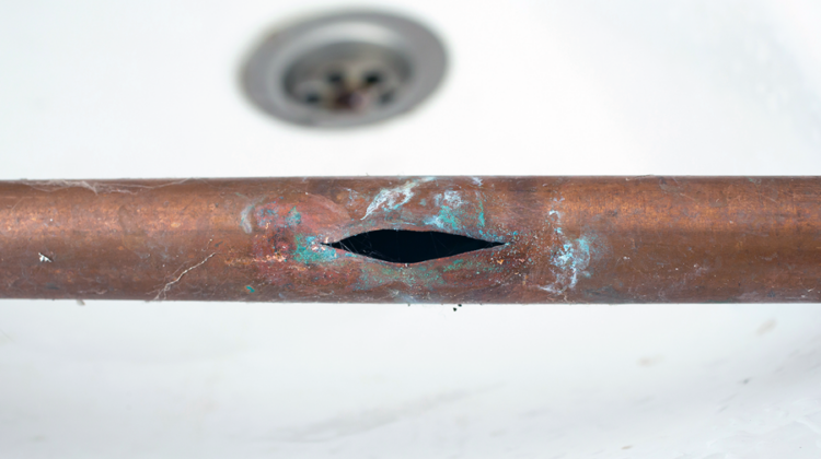 copper water pipe that has burst from freezing temperatures