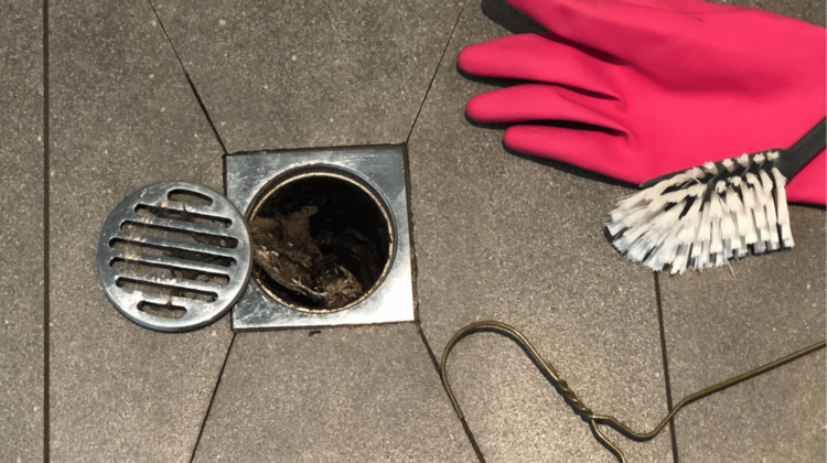 clogged floor drain with clean-out supplies