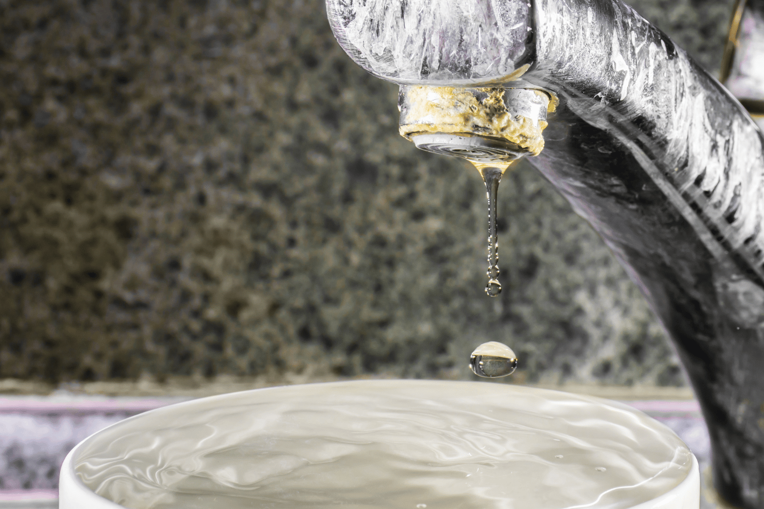 bathroom faucet with hard water deposits