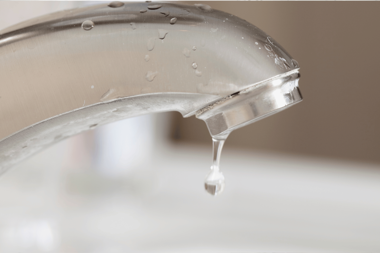 close-up of dripping bathroom faucet